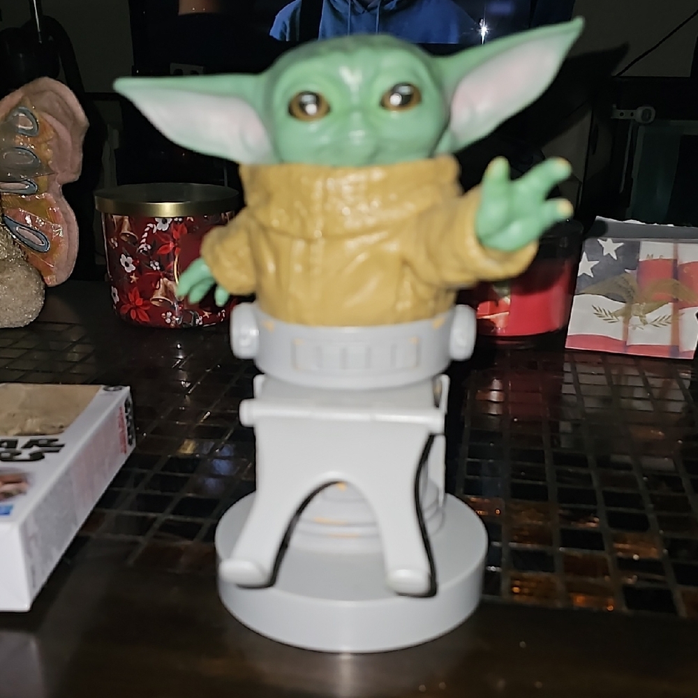 Green and Tan Figurine with White Base